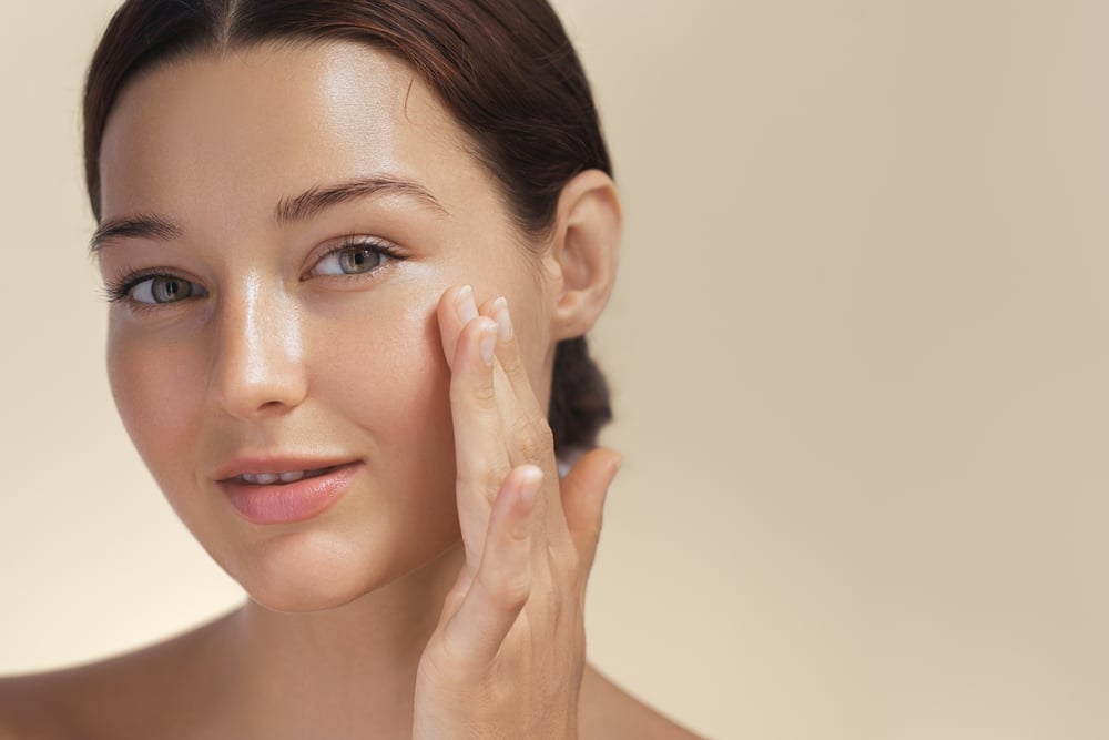 Skincare.,Woman,With,Beautiful,Face,Touching,Healthy,Facial,Skin,Portrait. Laser & Light Treatments in Omaha